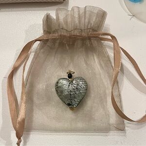 Rare Murano glass heart pendant.
Silver/Black foil interior/Gold toned accents